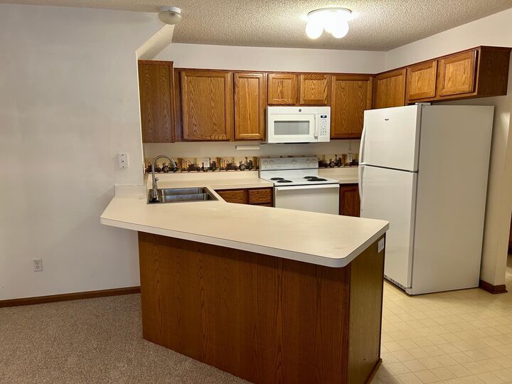 Property Photo:  1729 Riverwood Drive 64  MN 55337 
