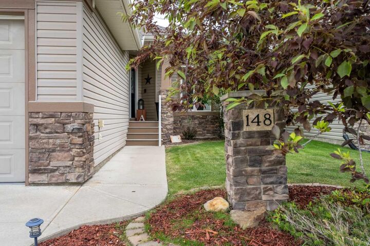Property Photo:  148 Cimarron Park Circle  AB T1S 2L6 