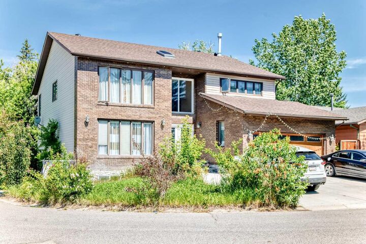 Property Photo: 204 Deer Ridge Way SE AB T2J 5Y6