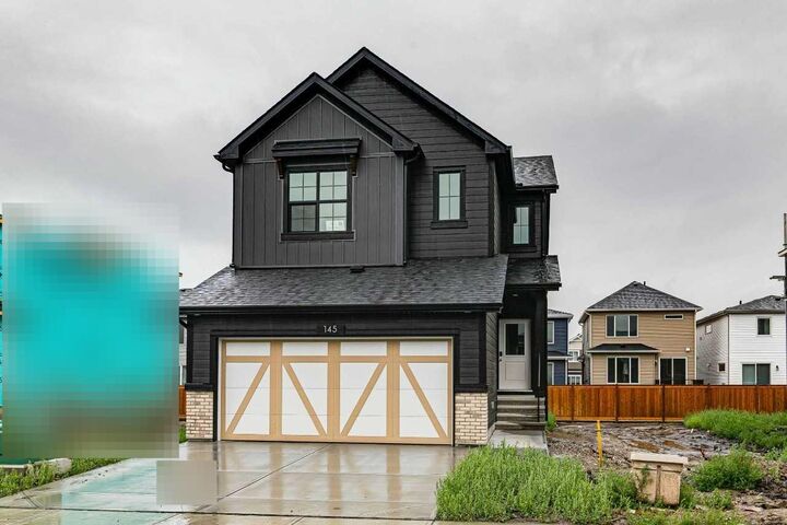 Property Photo: 145 Snowberry Common SE AB T3M 4G6