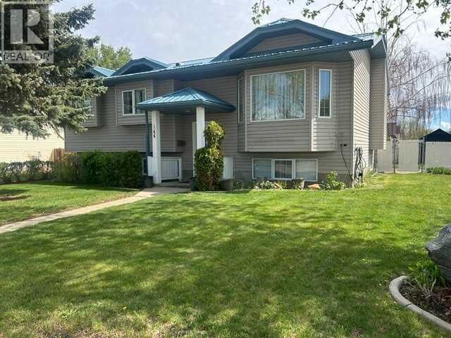 Property Photo: 144 Upland Boulevard West AB T1R 0R3