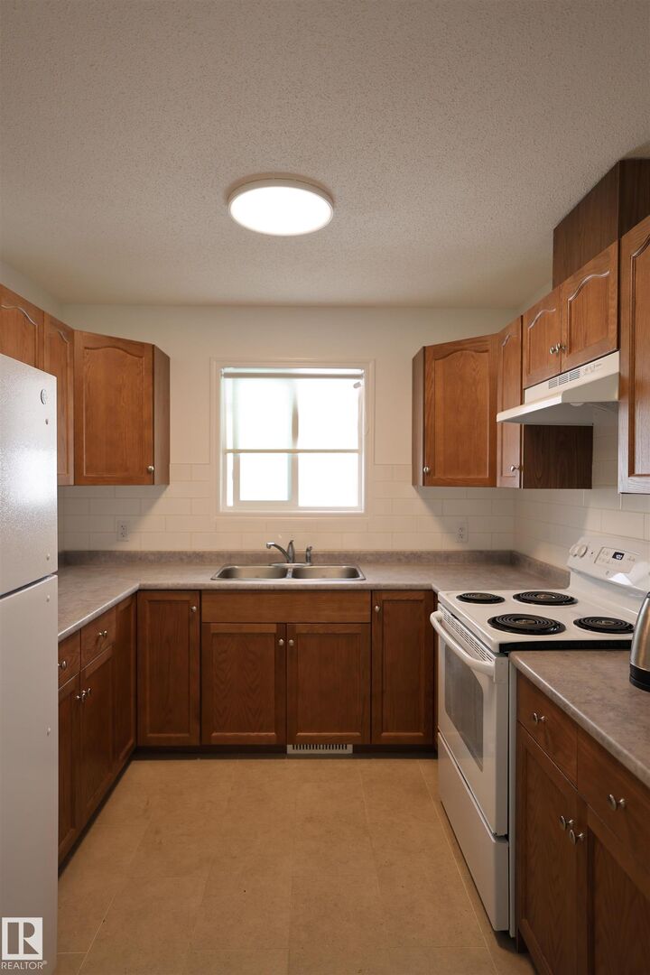 Property Photo:  11120 132 Street NW  AB T5M 1E6 