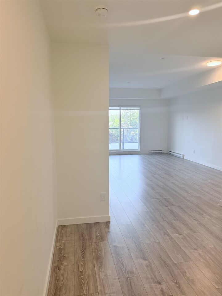 Property Photo:  E305 10829  140 St  BC V3R 0H4 