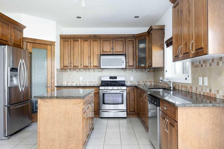 Property Photo:  322 Grosbeak Way  AB T9K 0L8 
