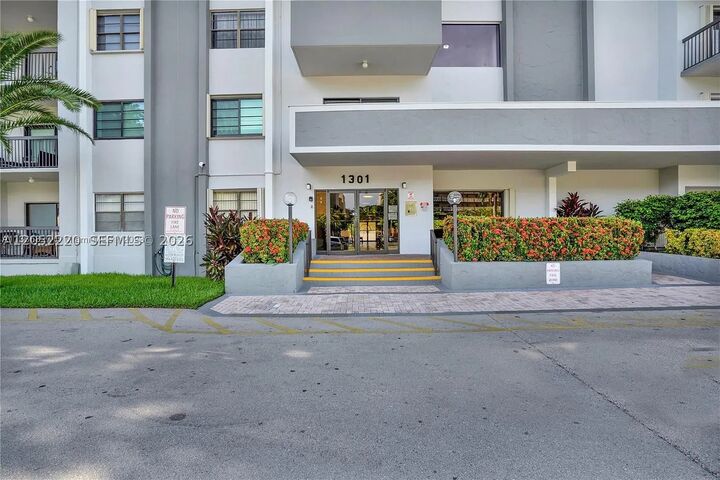 Property Photo:  1301 NE 7th 405  FL 33009 