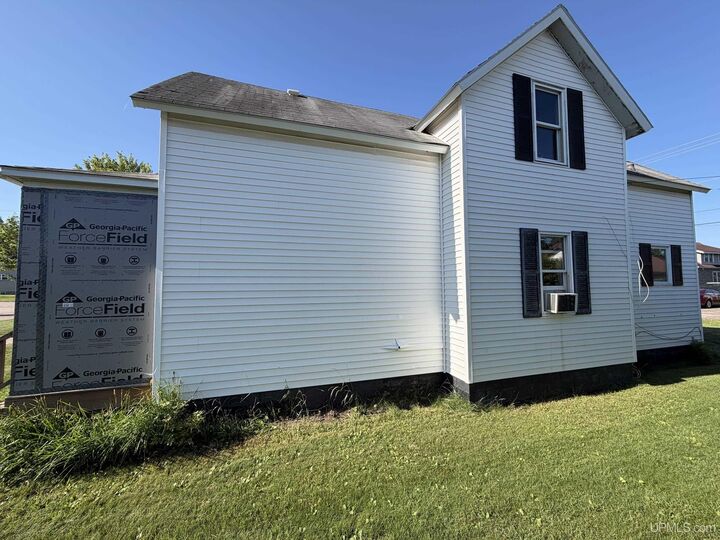 Property Photo:  307 Iron Street  MI 49870-1323 