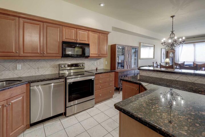 Property Photo: 11642 Valley Ridge Park NW 105 AB T3B 5Z5