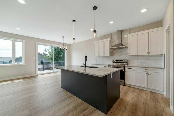 Property Photo:  103 Riverford Close W  AB T1K 8E6 