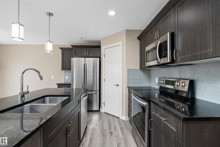 Property Photo:  217 Sunpine Pointe  AB T8H 0Z6 