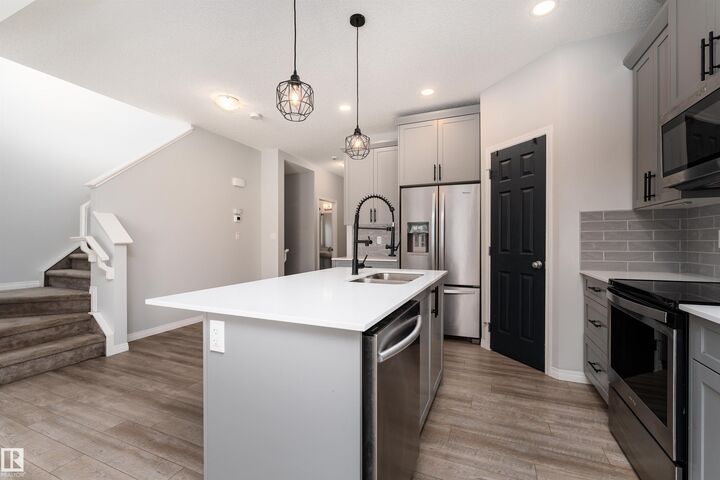 Property Photo:  6484 King Wynd SW  AB T6W 3Z9 
