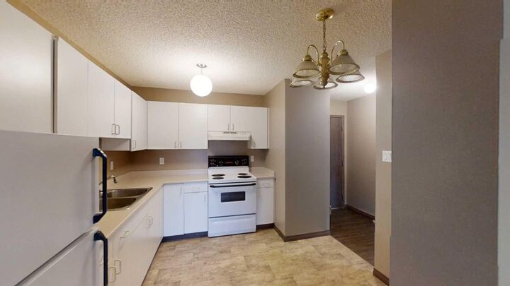 Property Photo: 5117 44 Street 205 AB T0G 1E0