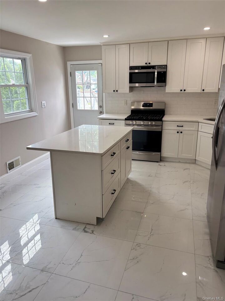Property Photo:  128 W 17th Street  NY 11729 