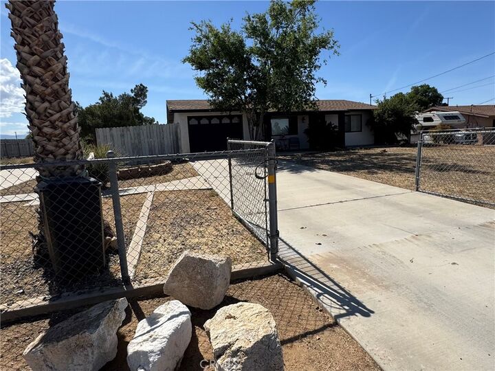 Property Photo:  11968 Bornite Ave  CA 92345 