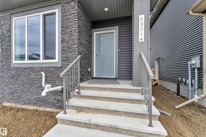 Property Photo: 6371 King Wynd SW AB T6W 5J3