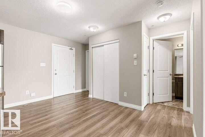 Property Photo: 50 Woodsmere Close 336 AB T8L 4N9