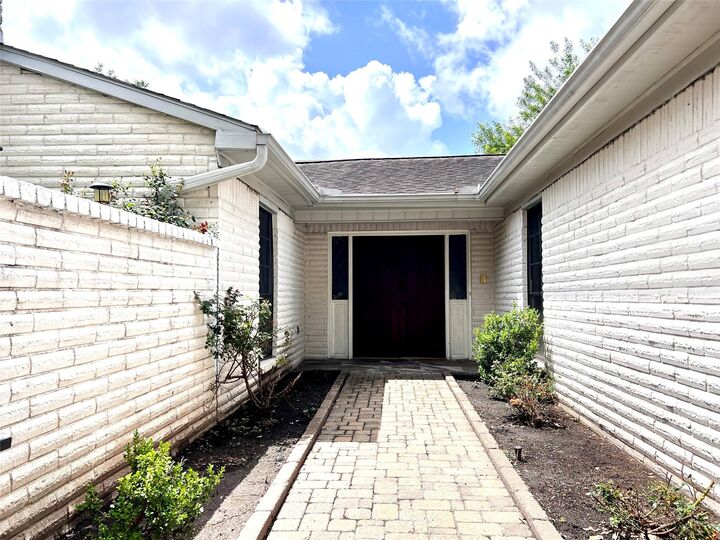 Property Photo: 13819 Wickersham Lane TX 77077