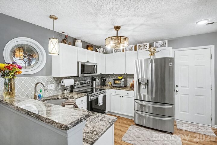 Property Photo: 4828 Asherton Place NW NC 28027