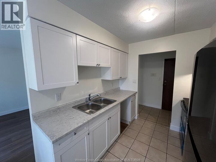 Property Photo:  11822 Tecumseh Road East 105  ON N8N 1L7 