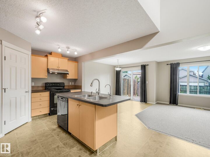 Property Photo:  11844 21 Avenue SW  AB T6W 0C9 