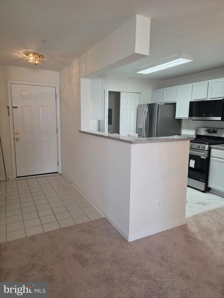 Property Photo:  8095 Lacy Drive 202  VA 20109 