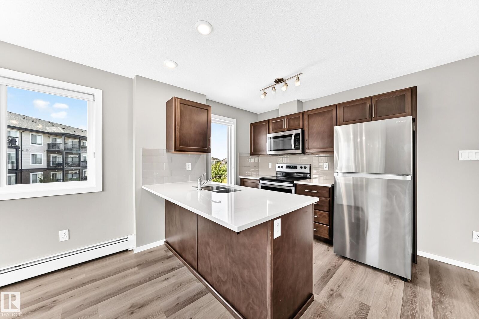 Property Photo:  148 Ebbers Boulevard NW 322  AB T5Y 3W2 
