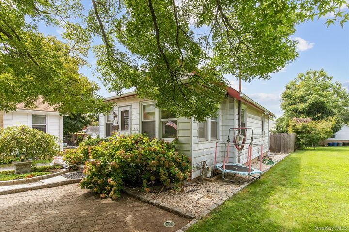 Property Photo:  44 Perry Avenue  NY 11709 