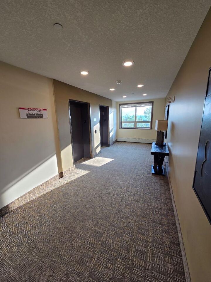 Property Photo:  204 Sparrow Hawk Drive NW 1404  AB T9K 0P1 