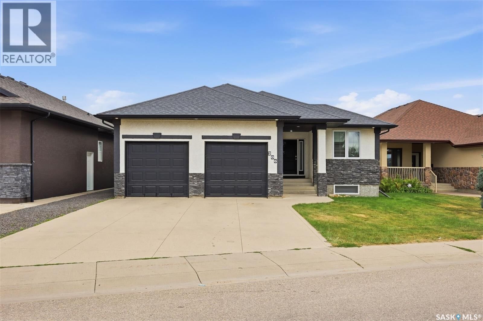 Property Photo: 206 Muzyka Road SK S7W 0G9