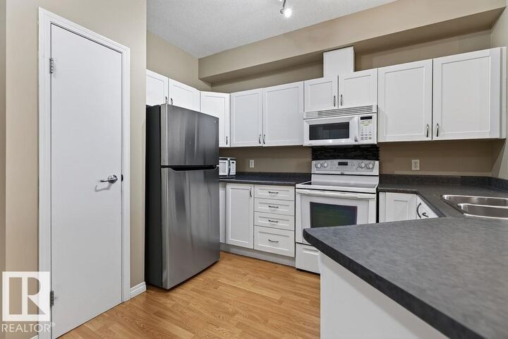 Property Photo: #205 4304 139 Av NW AB T5Y 0H6