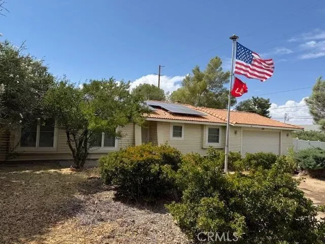 Property Photo:  9018 Guava  CA 92345 