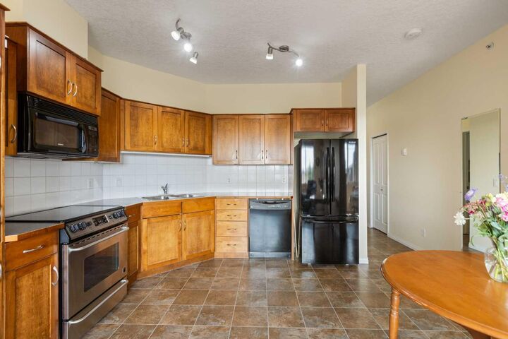 Property Photo: 43 Sunrise Loop SE 308 AB T1V 0A8
