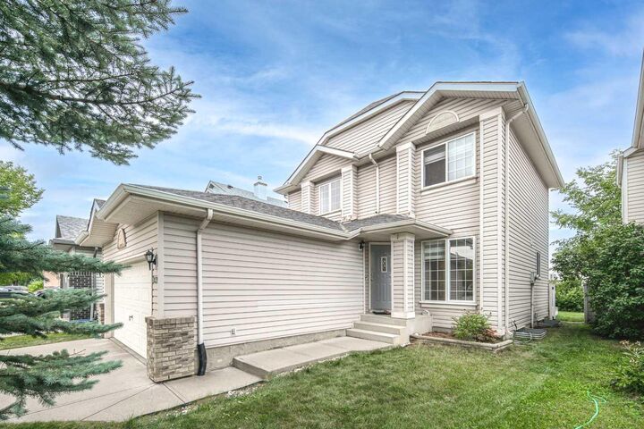 Property Photo: 859 Harvest Hills Drive NE AB T3K 4R4