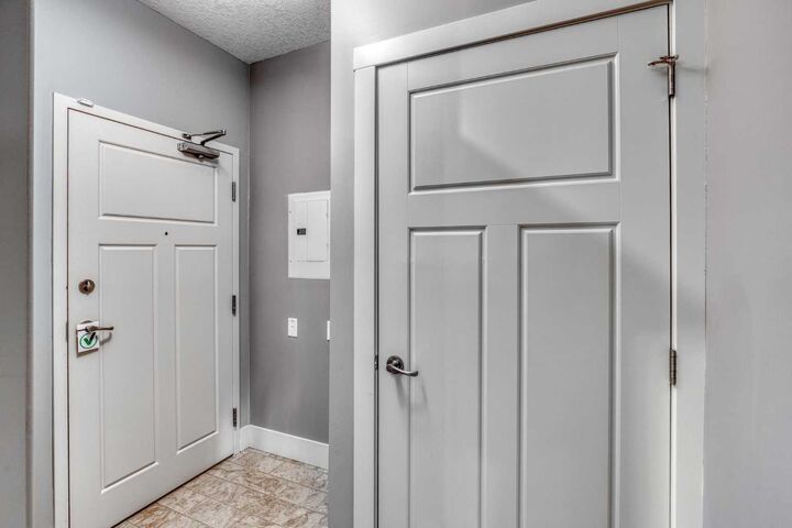 Property Photo:  77 George Fox Trail W 117  AB T4C 0N1 