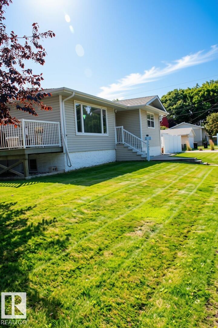 Property Photo:  7703 104 Avenue NW  AB T6A 0J4 