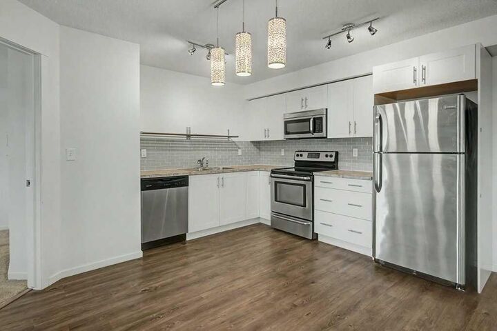 Property Photo:  755 Copperpond Boulevard SE 3210  AB T2Z 4R2 