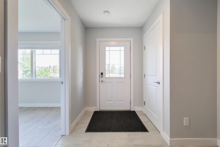 Property Photo:  11373 12 Avenue NW 3  AB T6J 5V2 