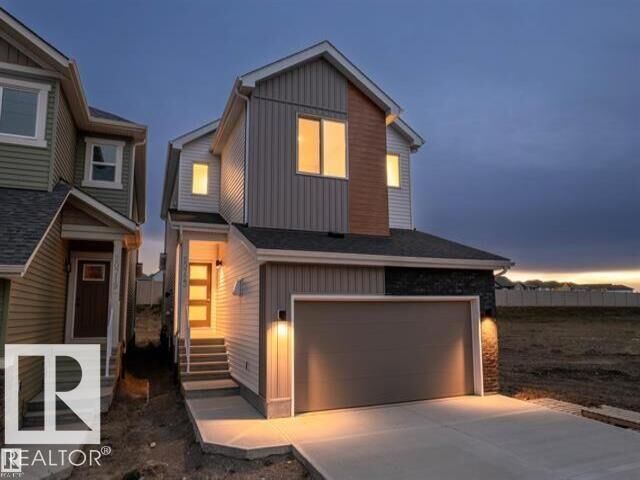 Property Photo:  20723 24 Avenue NW  AB T6M 2C4 