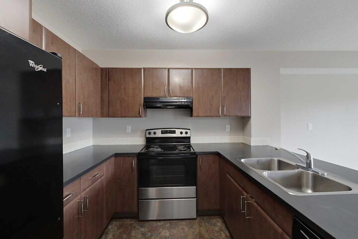 Property Photo:  709 6 Avenue SE 205  AB T0G 2A3 