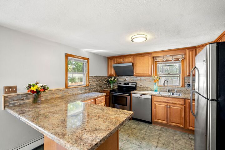 Property Photo:  62 Armand Avenue  NH 03103 