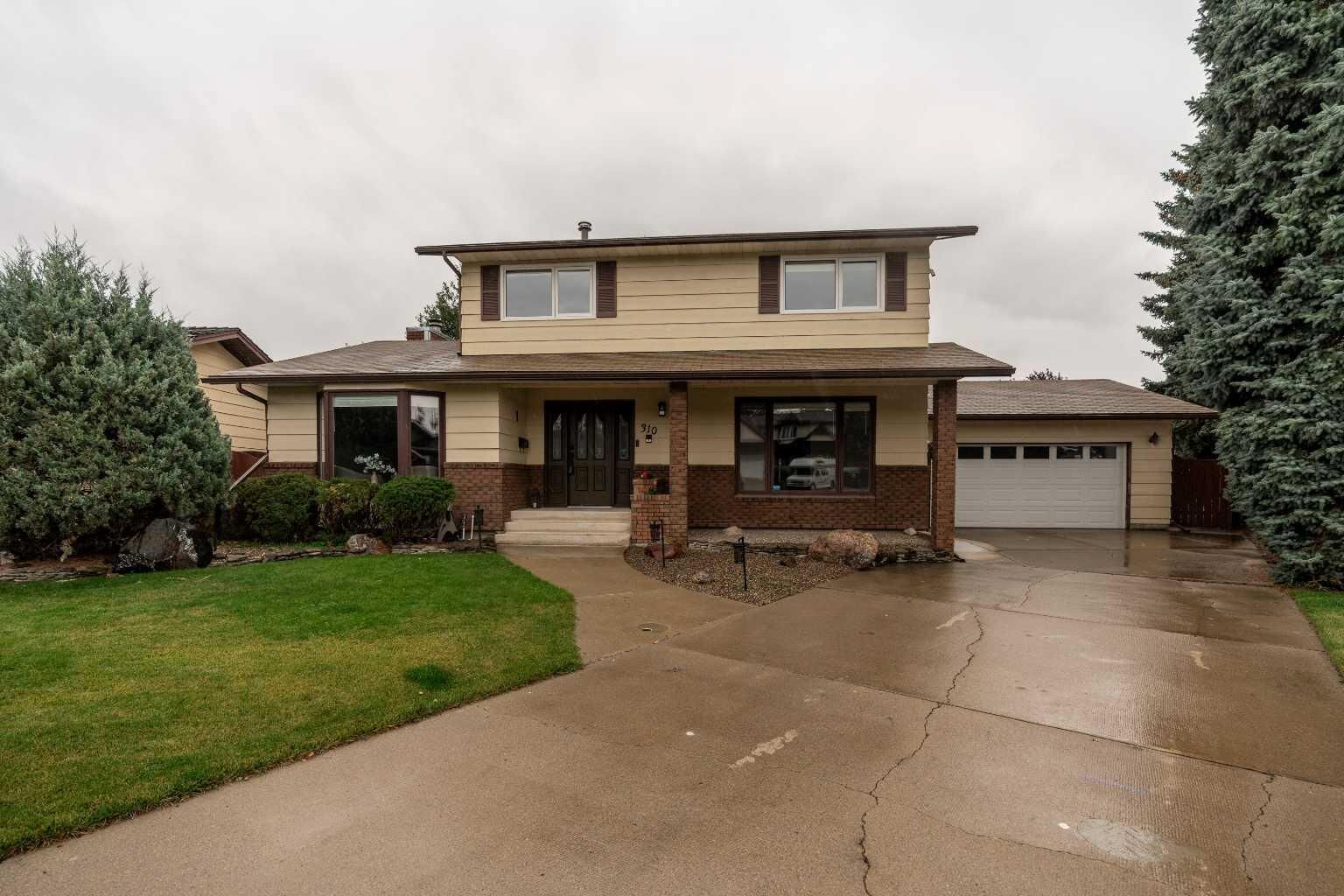 Property Photo:  310 Kings Bay S  AB T1K 5G2 