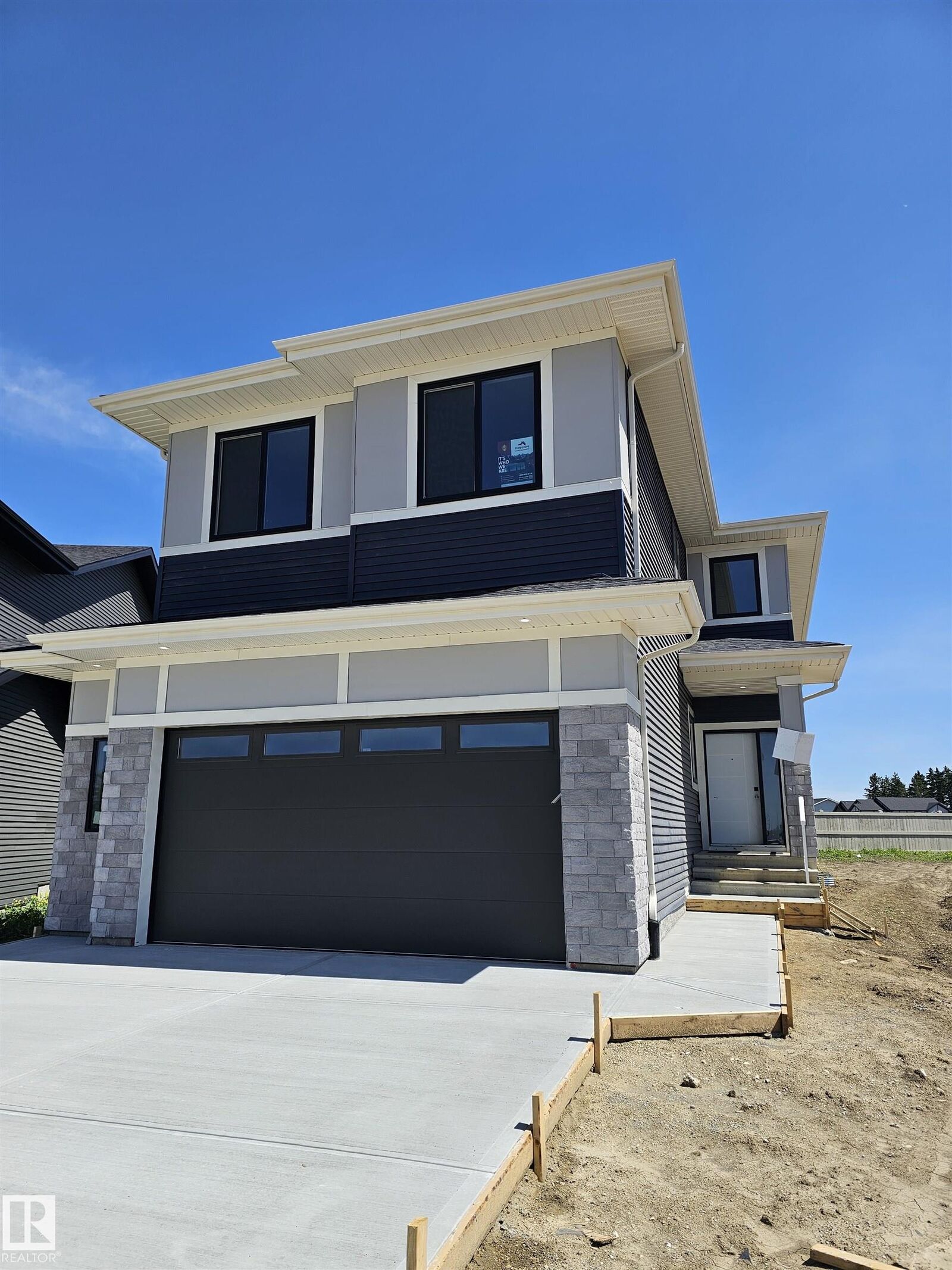 Property Photo: 3311 Chernowski Way SW AB T6W 5H2