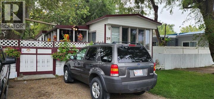 Property Photo:  59 Greenbrook  Mobile Village  AB T1R 0R7 