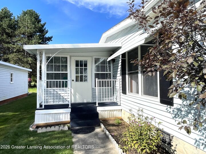 Property Photo:  102 Saint Ives N  MI 48906 