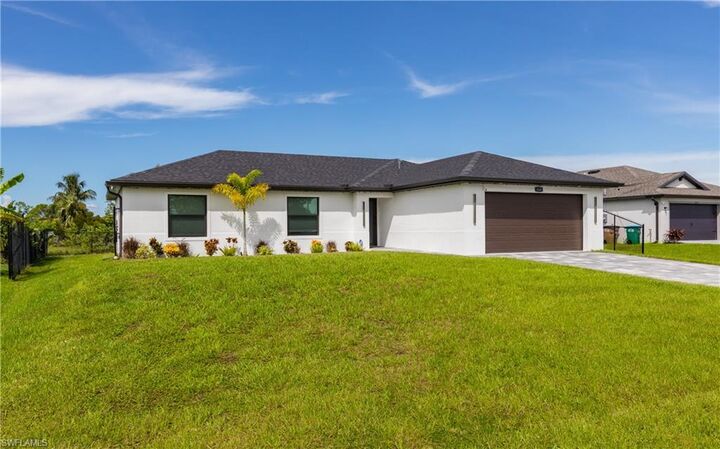 Property Photo:  416 NW 25th Ave  FL 33993 