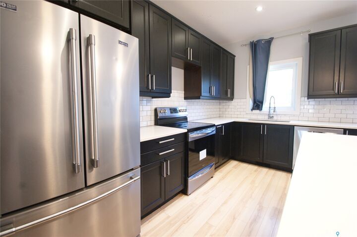 Property Photo:  1303A Broadway Avenue  SK S7H 2A5 