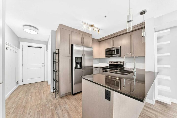 Property Photo:  11 Mahogany Row SE 1115  AB T3M 2L6 