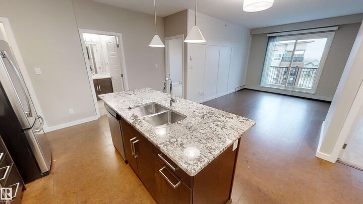 Property Photo:  5510 Schonsee Drive NW 404  AB T5Z 0N9 