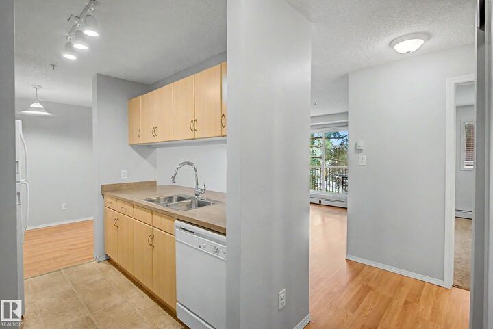 Property Photo:  2430 Guardian Road NW 204  AB T5T 6X9 