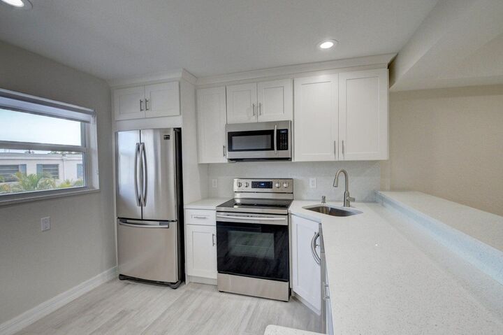 Property Photo:  398 W Camino Real 1  FL 33432 