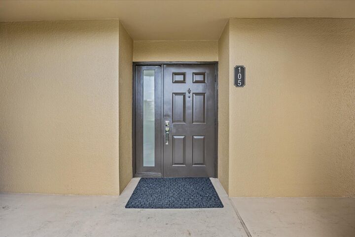 Property Photo:  5390 Woodland Lakes Drive 105  FL 33418 